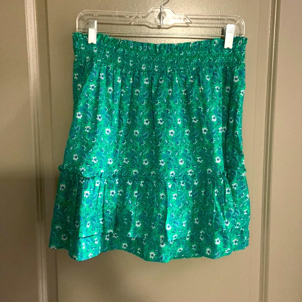 Green ruffled skirt. Paisley pattern with blue and white.